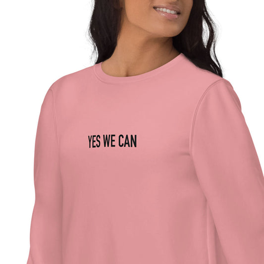 Women pink sustainable sweatshirt with Barack Obama's inspirational quote, "Yes We Can." 