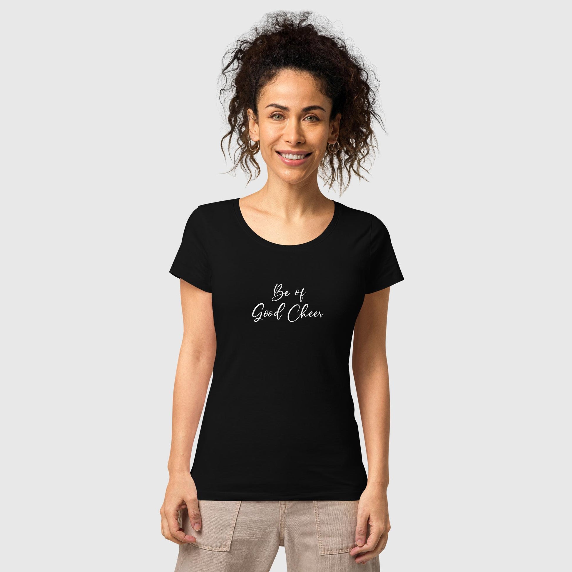 Women's black organic cotton t-shirt that features the positive quote, "Be of Good Cheer."