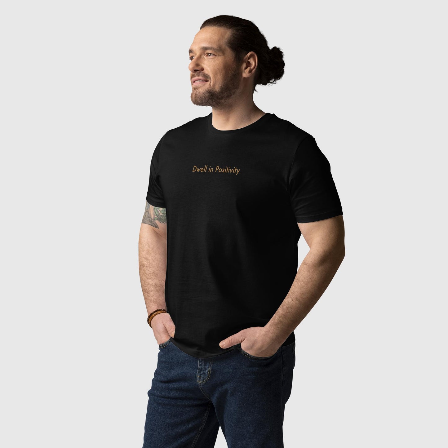 Men's black organic cotton t-shirt that features Emily Dickinson's quote, "I dwell in positivity."