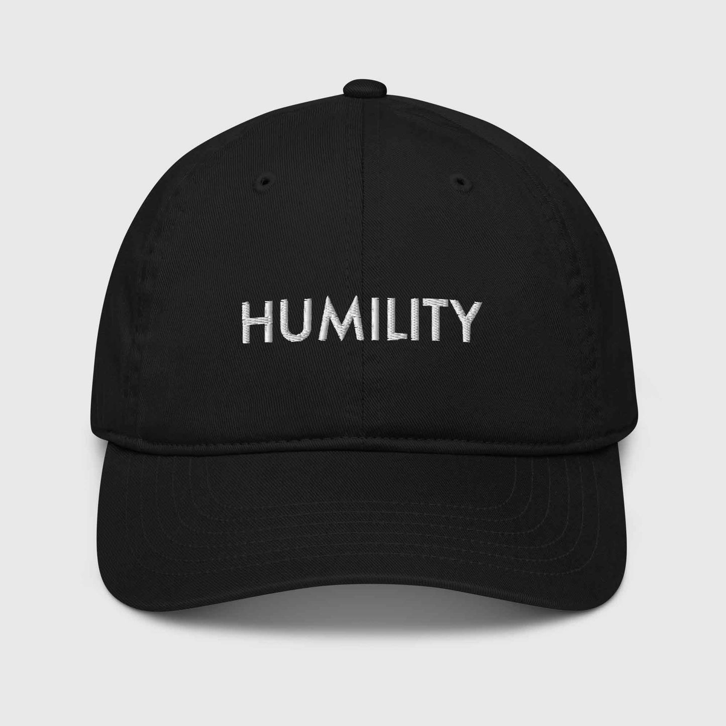 Black organic cotton baseball cap that says, "Humility"