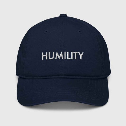 Navy organic cotton baseball cap that says, "Humility"