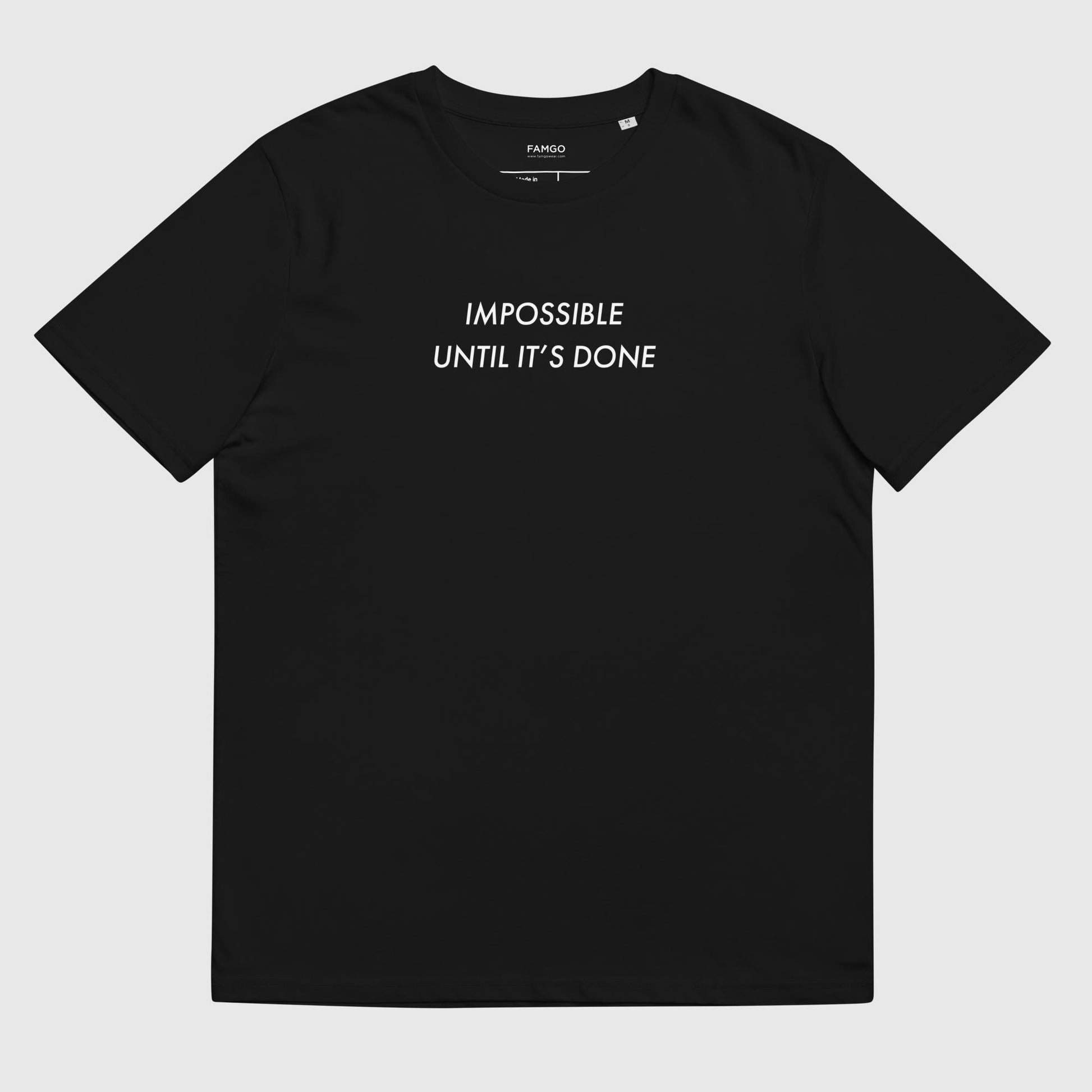 Men's black organic cotton t-shirt that features, "Impossible Until It's Done," inspired by Nelson Mandela's inspirational quote, "It always seems impossible until it's done."