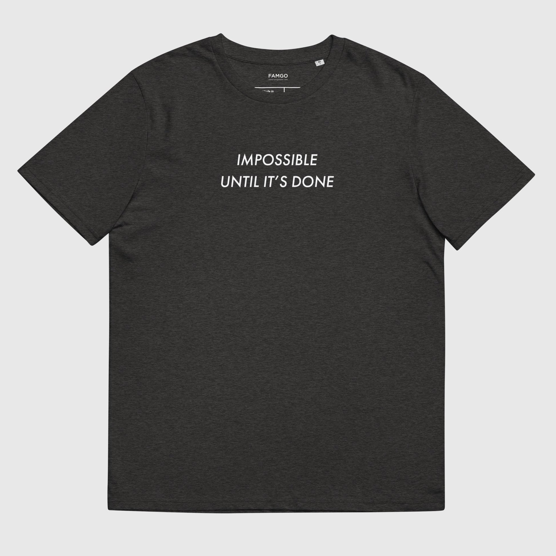 Men's dark gray organic cotton t-shirt that features, "Impossible Until It's Done," inspired by Nelson Mandela's inspirational quote, "It always seems impossible until it's done."