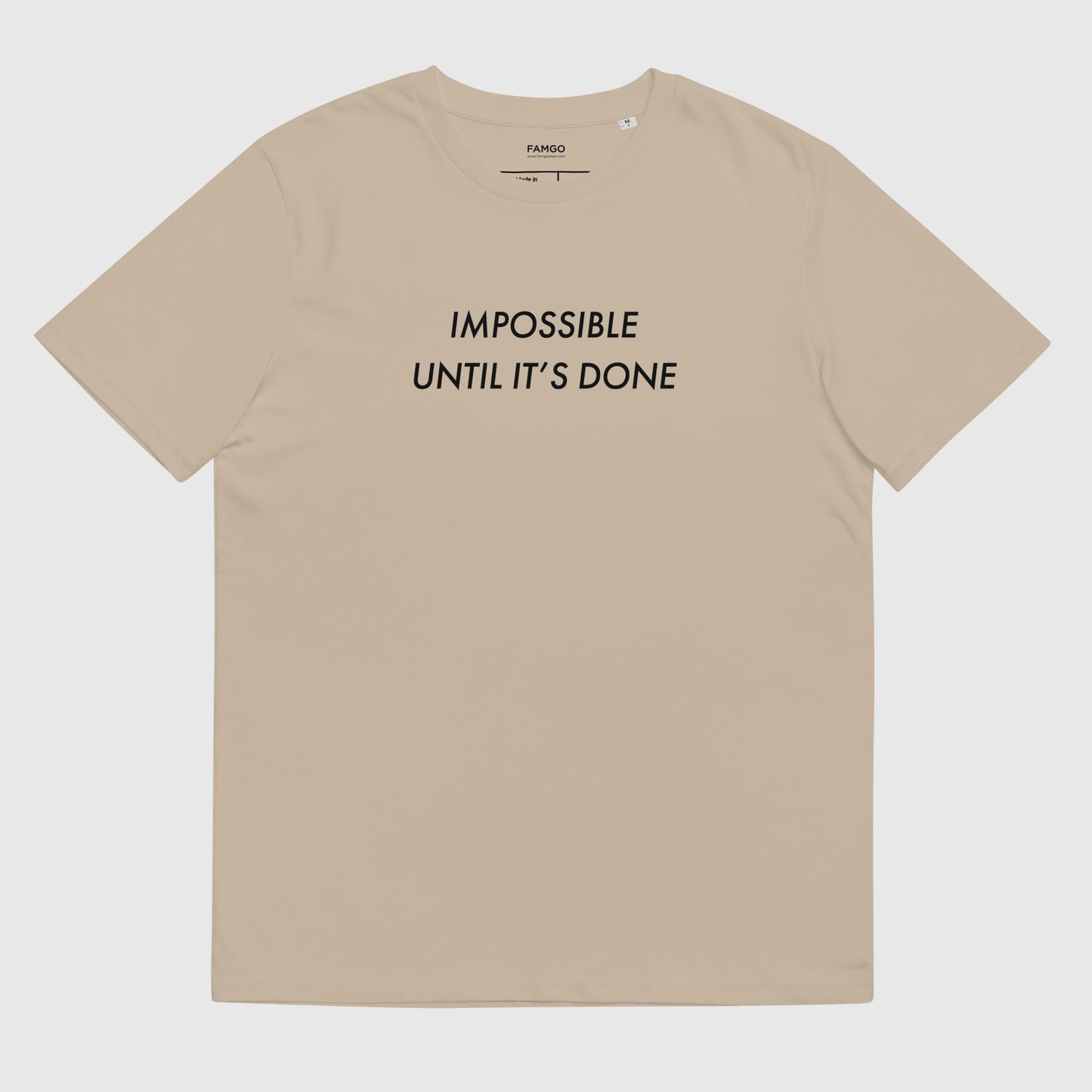 Men's desert dust organic cotton t-shirt that features, "Impossible Until It's Done," inspired by Nelson Mandela's inspirational quote, "It always seems impossible until it's done."