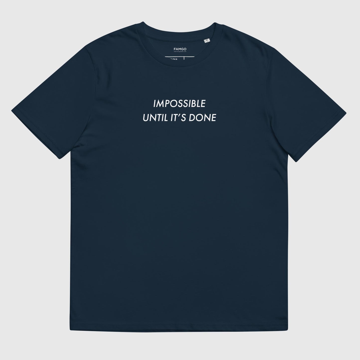 Men's french navy organic cotton t-shirt that features, "Impossible Until It's Done," inspired by Nelson Mandela's inspirational quote, "It always seems impossible until it's done."
