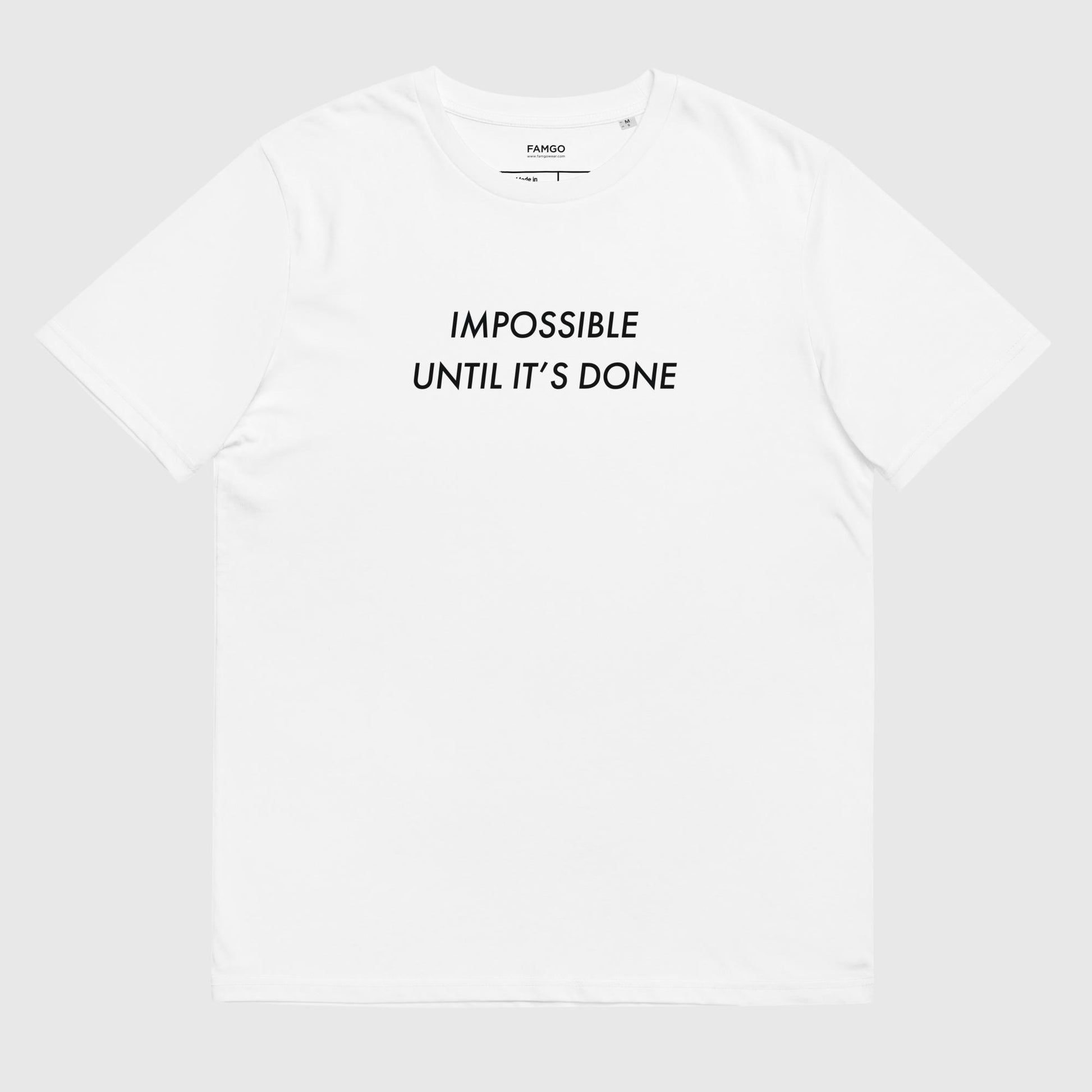 Men's white organic cotton t-shirt that features, "Impossible Until It's Done," inspired by Nelson Mandela's inspirational quote, "It always seems impossible until it's done."