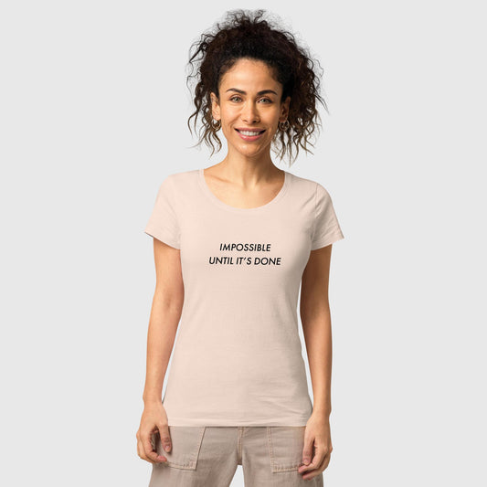 Women's creamy pink organic cotton t-shirt that features, "Impossible Until It's Done," inspired by Nelson Mandela's inspirational quote, "It always seems impossible until it's done."