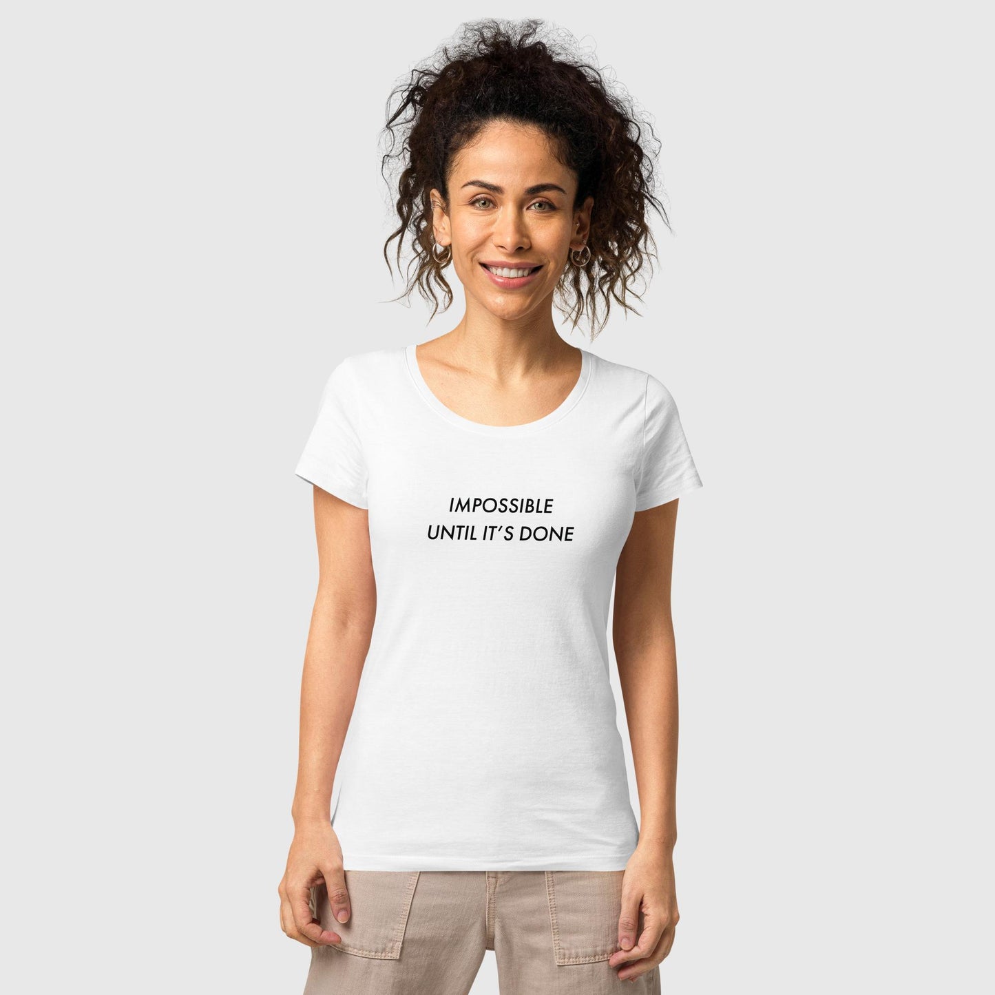 Women's white organic cotton t-shirt that features, "Impossible Until It's Done," inspired by Nelson Mandela's inspirational quote, "It always seems impossible until it's done."