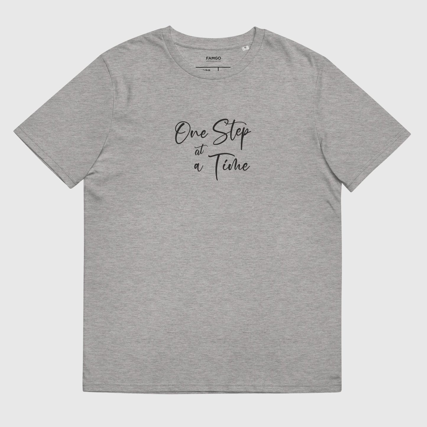 Men's heather gray organic cotton t-shirt that features the positive saying, "One Step At A Time."