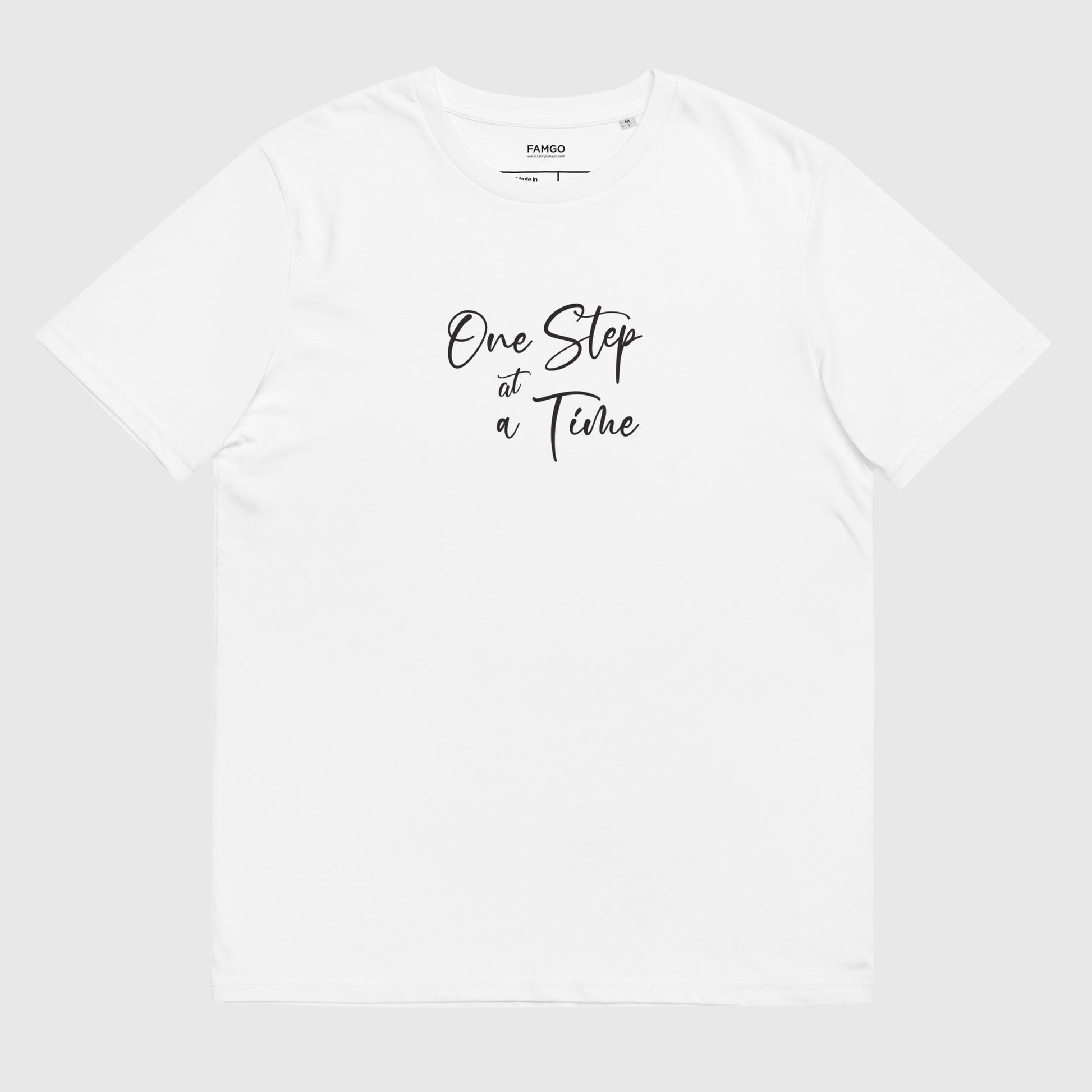 Men's white organic cotton t-shirt that features the positive saying, "One Step At A Time."