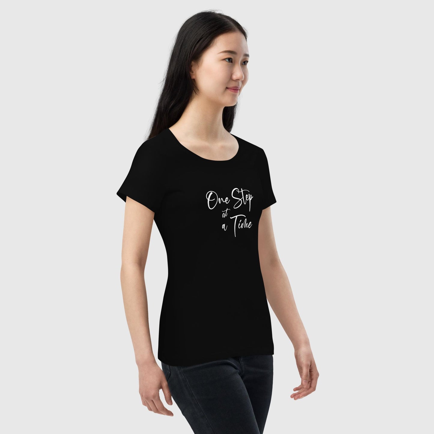 Women's black organic cotton t-shirt that features the inspirational quote, "One Step At A Time."