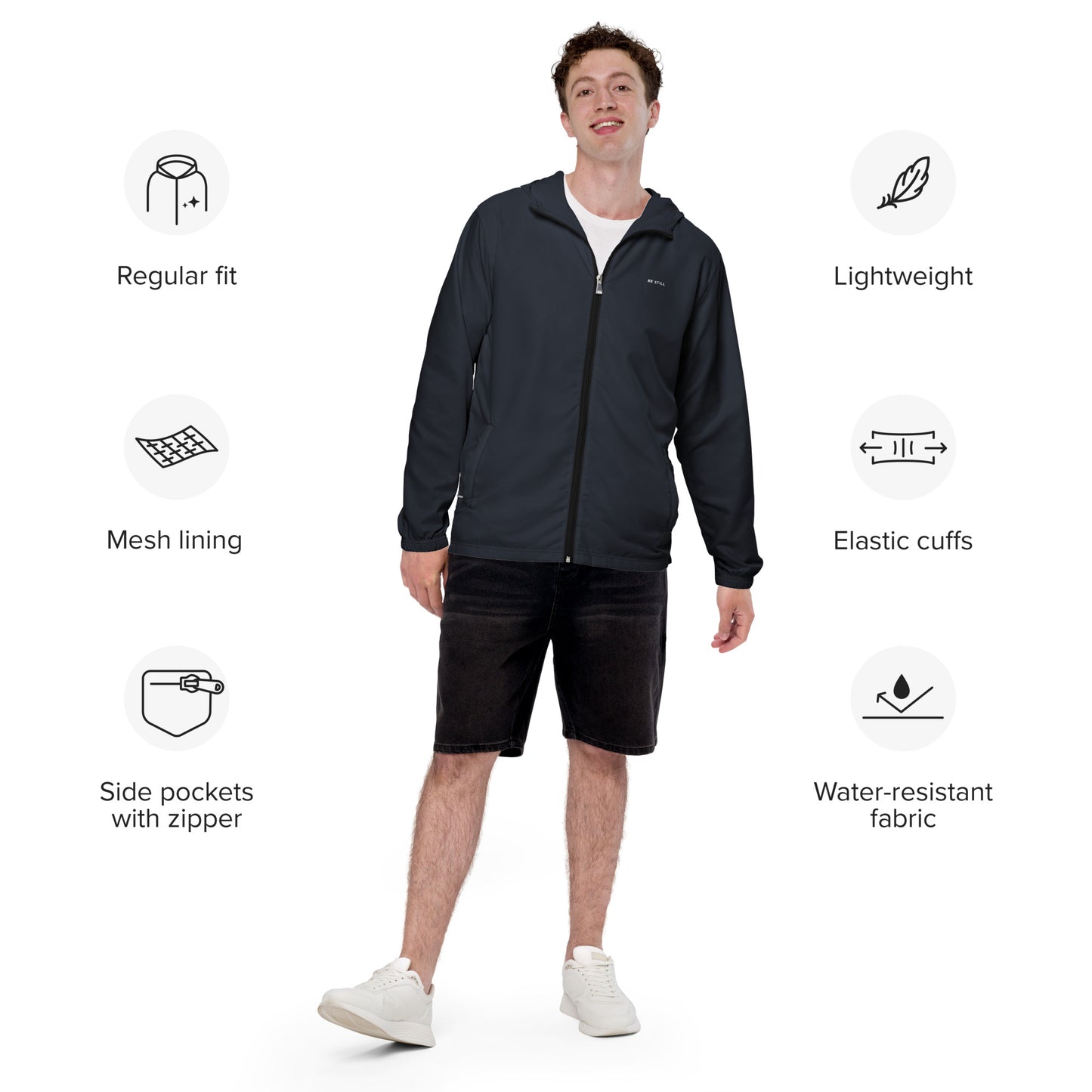 Features of the "Be Still" inspirational quote water-resistant windbreaker jacket: lightweight, side pockets with zipper, mesh lining